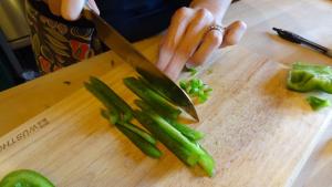 Cutting green peppers