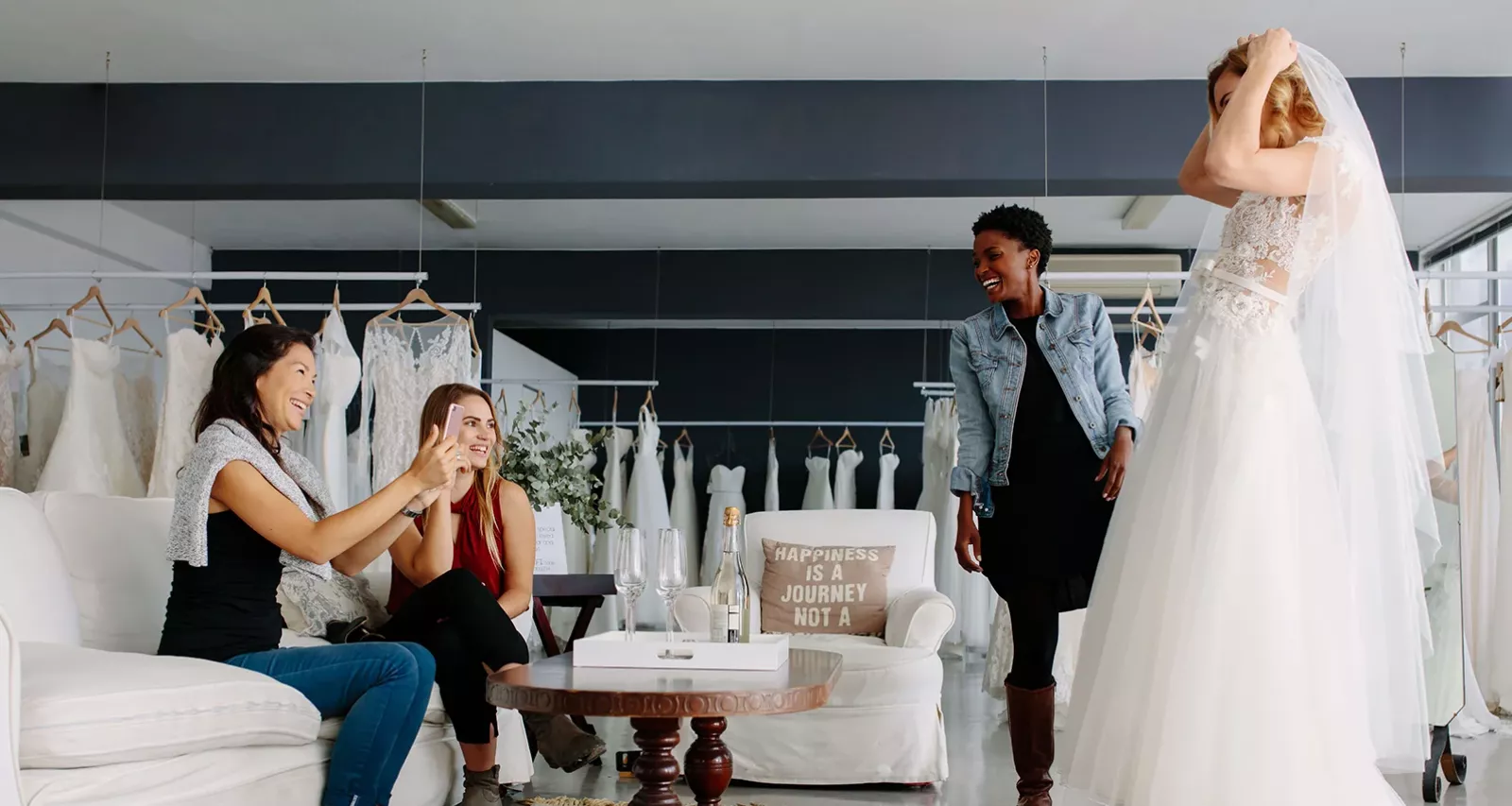 bride and bridesmaids at fitting